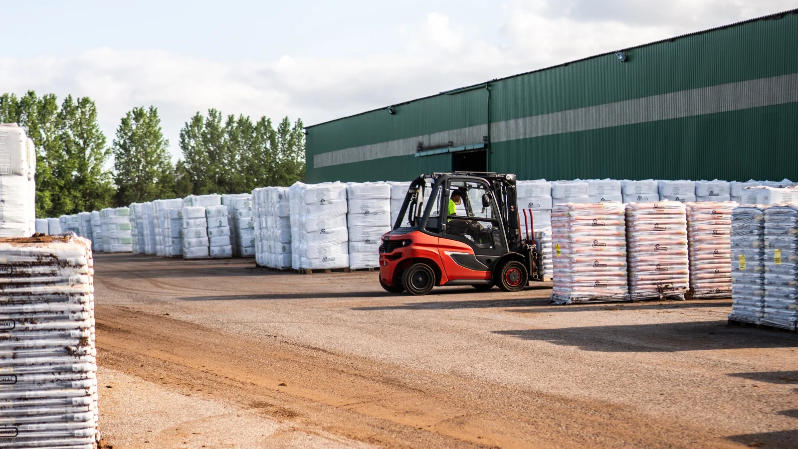 Forklift moving palletised ASB Professional growing media at the Estonia production site